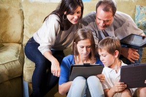 Family using digital tablets